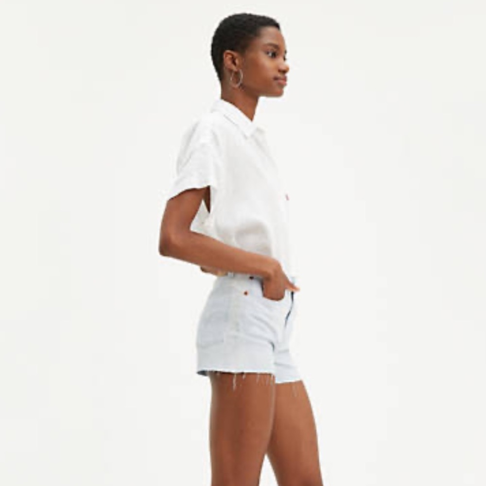 Levi’s high rise raw hem cutoffs in light wash